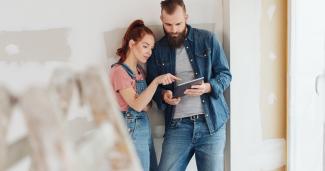 Man and woman looking at ipad