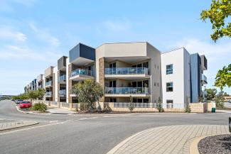 Front view of apartment building complex on a sunny day