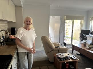 Julie in her kitchen of her new home