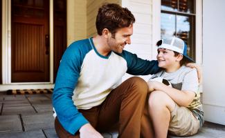 Father and son on front porch